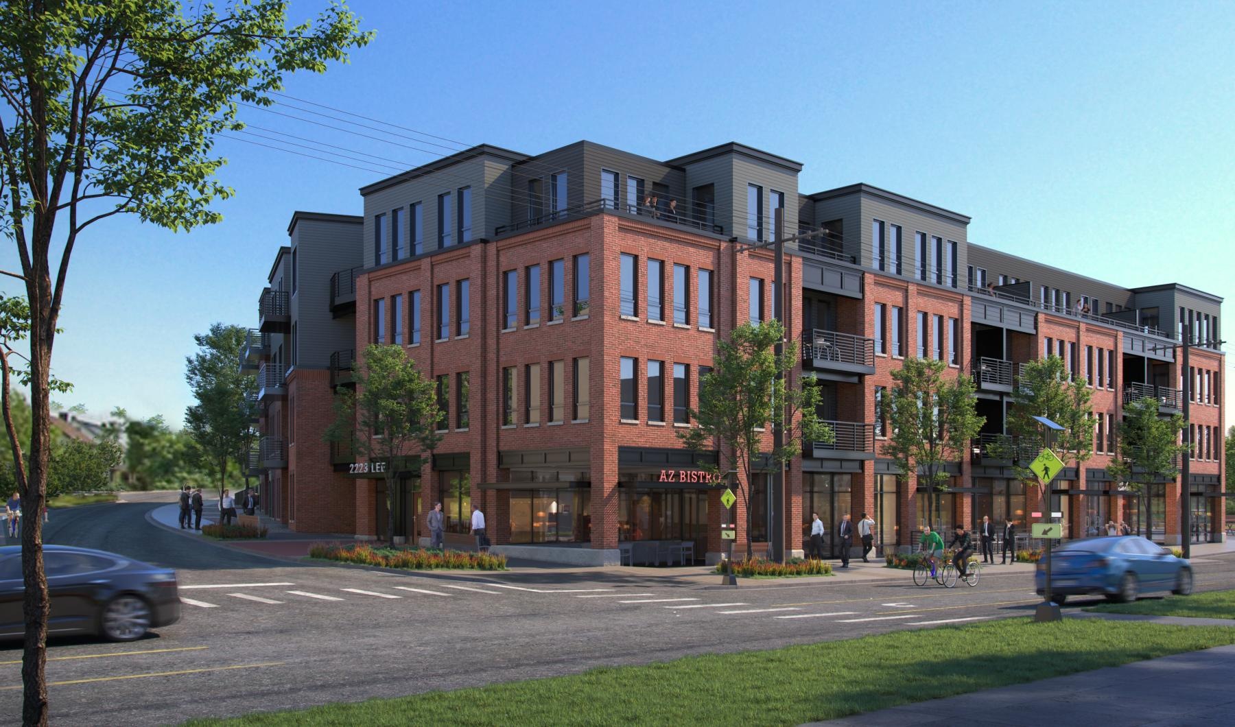 a large brick building with cars driving in front of it