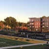 a football field with a building in the background