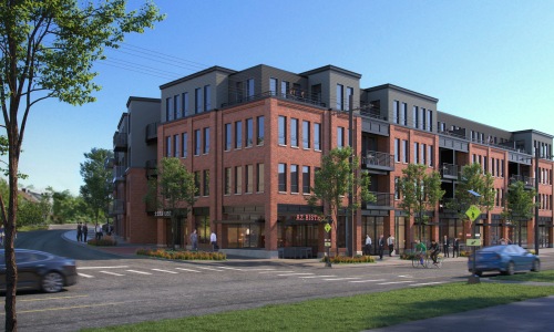 exterior of building with green turf and some seating