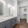 well lit bathroom with dual sinks