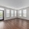 large living room surrounded by windows