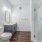 walk-in, glassed shower in well lit bathroom