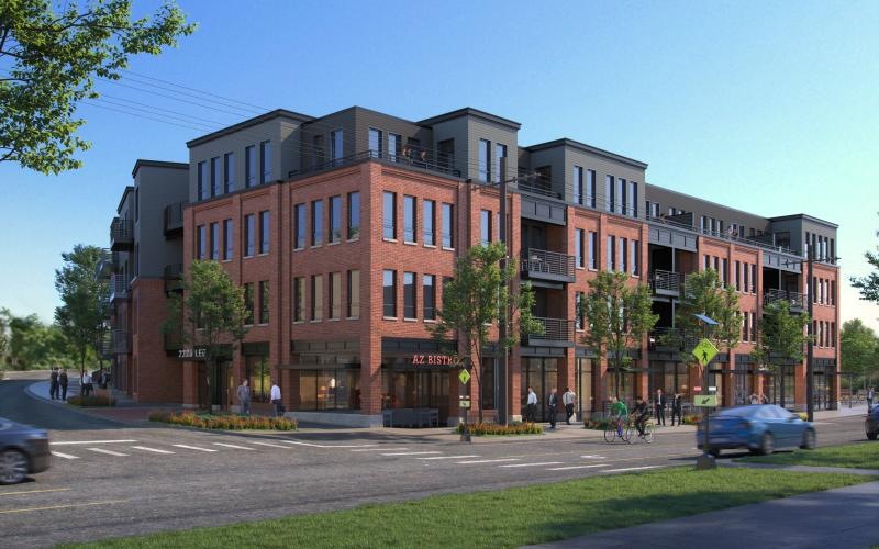 a large brick building with cars driving in front of it