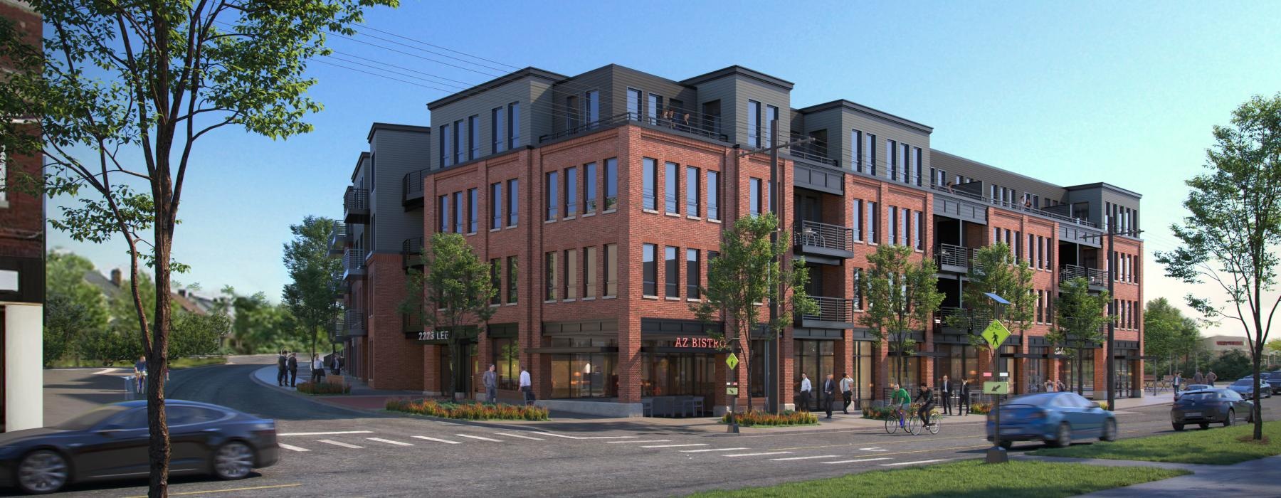 a large brick building with cars driving in front of it