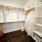 Built in organizers in walk-in closet